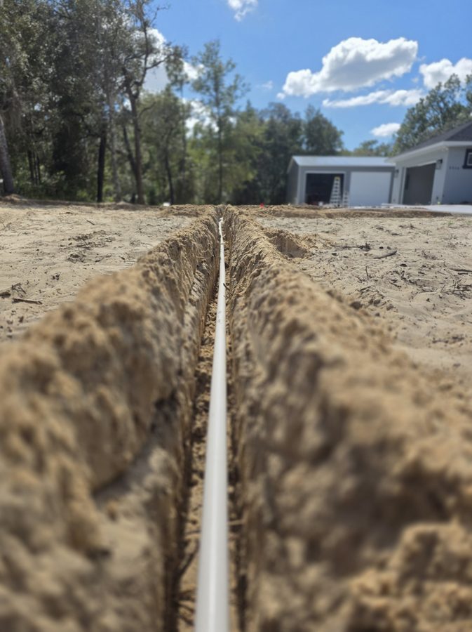 Fresh irrigation trench with main line β Citrus County new construction