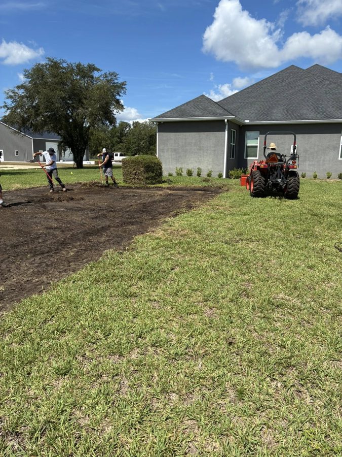 In the Zone Irrigation crew installing fresh sod on a Central Florida property